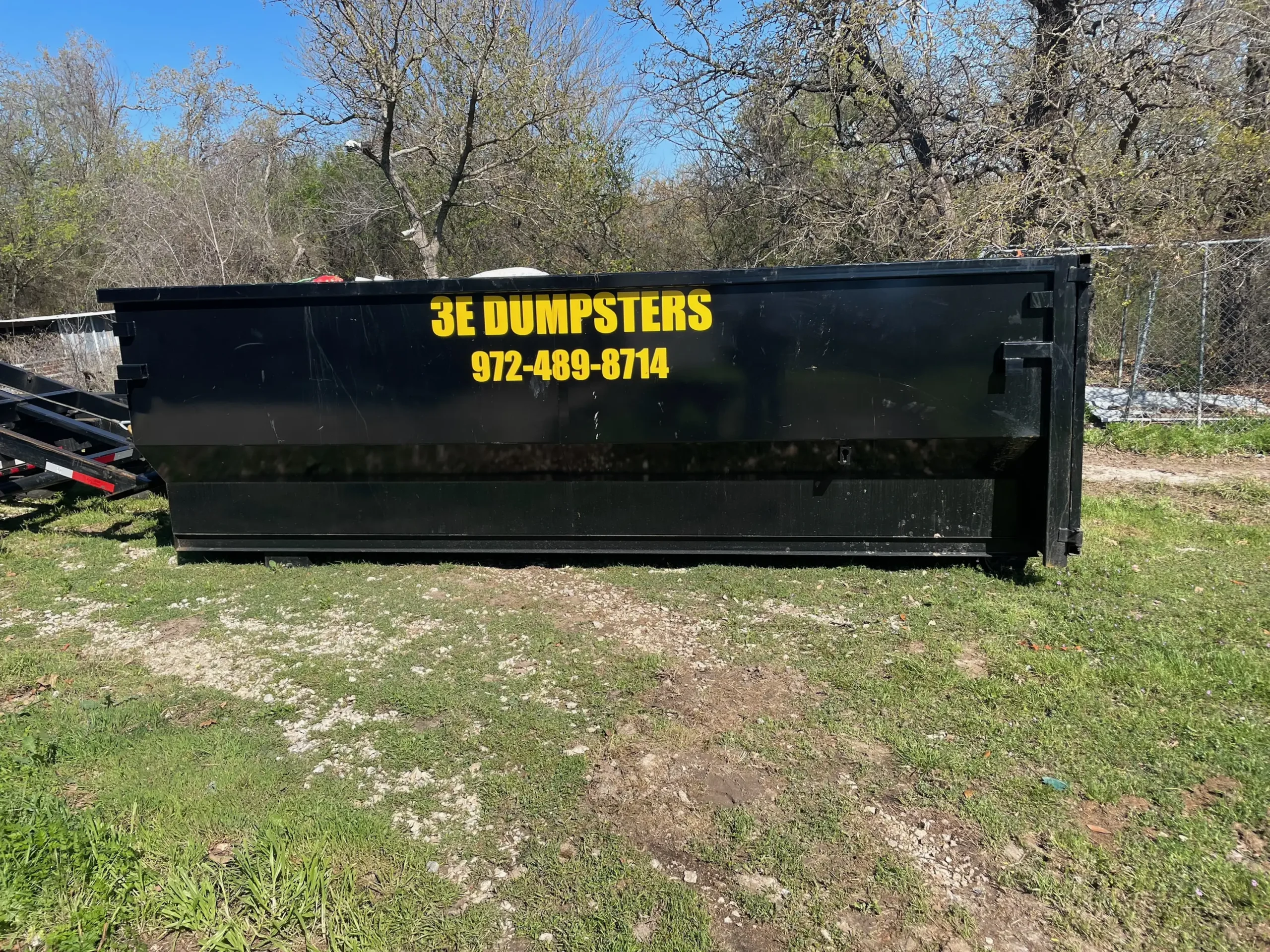 3E Dumpsters branded roll-off dumpster side view serving Tarrant County TX