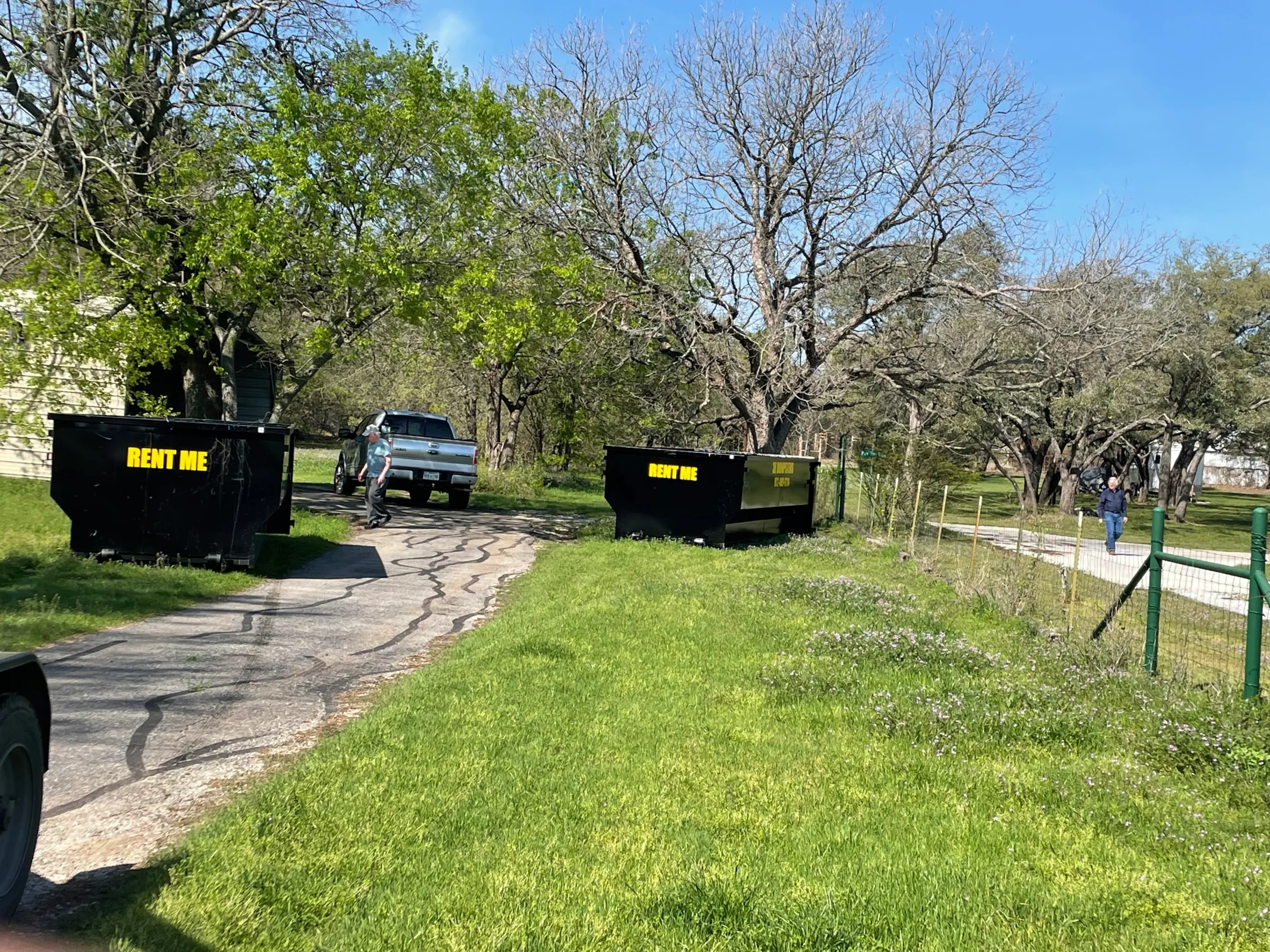 Two 3E Dumpsters roll-off containers ready for delivery in Parker County Texas